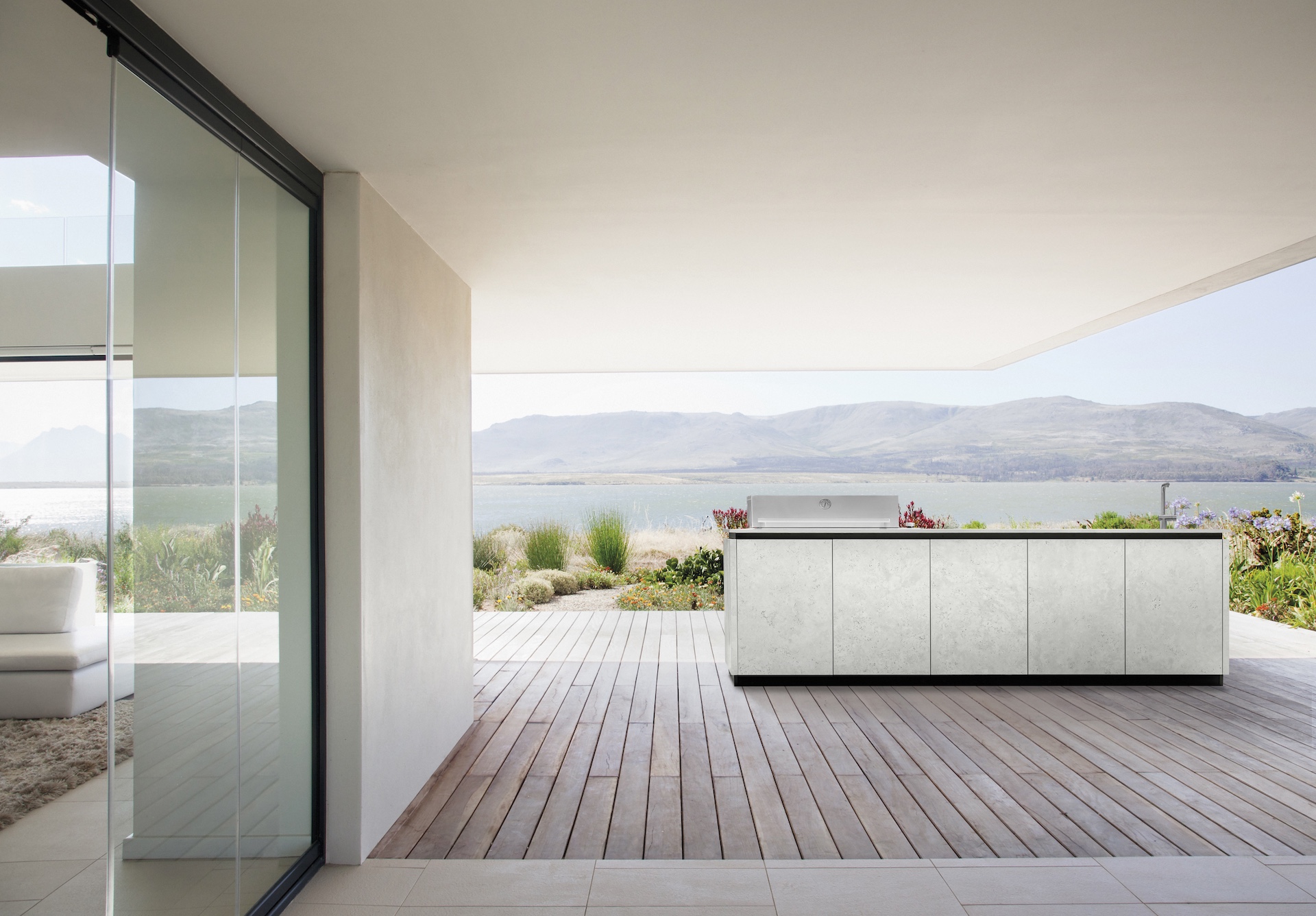 View of lake from patio of modern house
